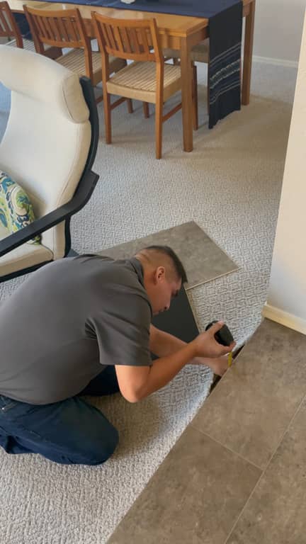 crew member installing flooring in home | Vision Flooring | Phoenix, AZ and Chandler, AZ